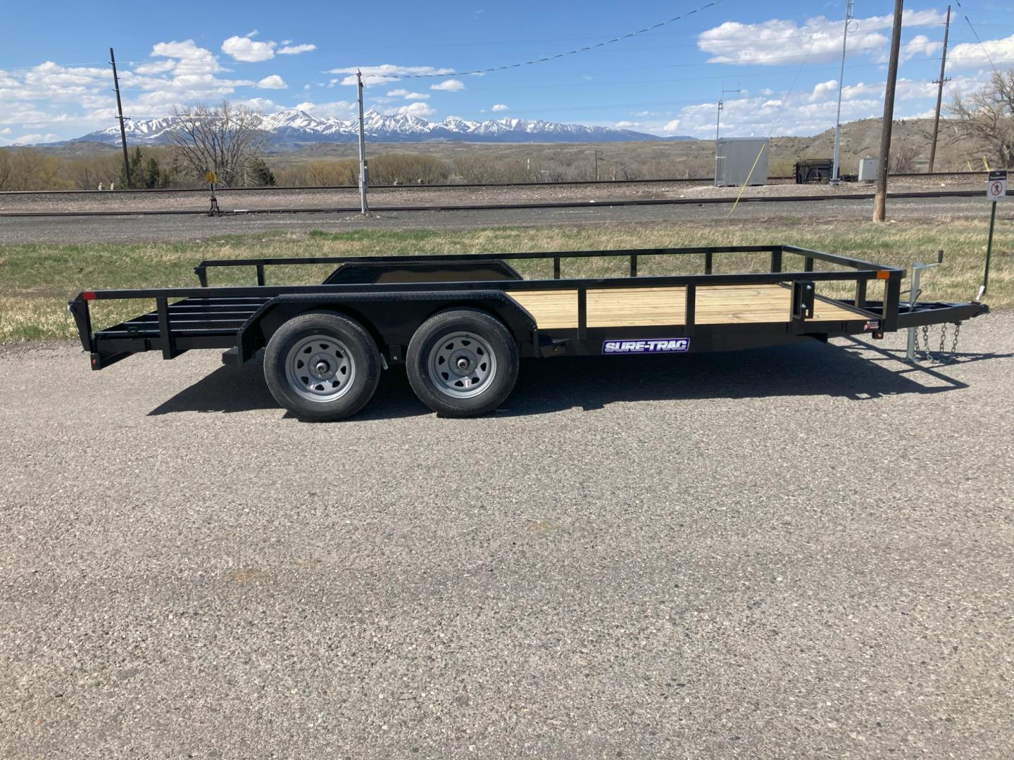 2025 , located at 310 West 1st Ave, Big Timber, MT, 59011, (406) 860-8510, 45.833511, -109.957809 - SureTrac 7 x 16 tube Top Utility - 7K GVW, (2) 3.5k axles with quick lube hubs, electric brakes on all wheels, spring suspension, all LED lights, 15" radial tires, set back top wind jack, safety chains, battery breakaway switch, (13") tall 2 x 2 tube top rail, stake pockets, (3) position rear gate - Photo#0